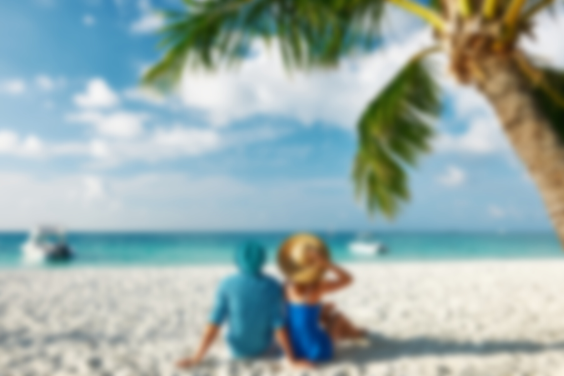 Couple in blue clothes on a beach at Maldives