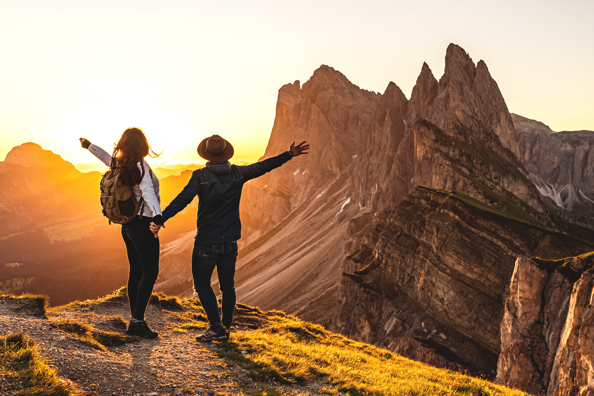 Couple backpackers travel mountains